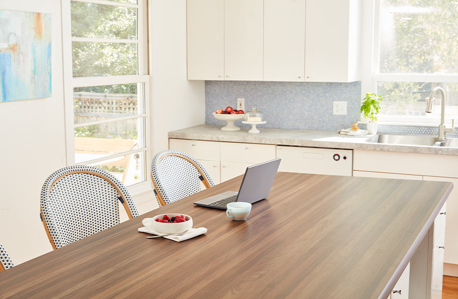 Kitchen with island in Formica Laminate Patine Concrete and countertop in Formica Laminate Walnut Butcherblock 