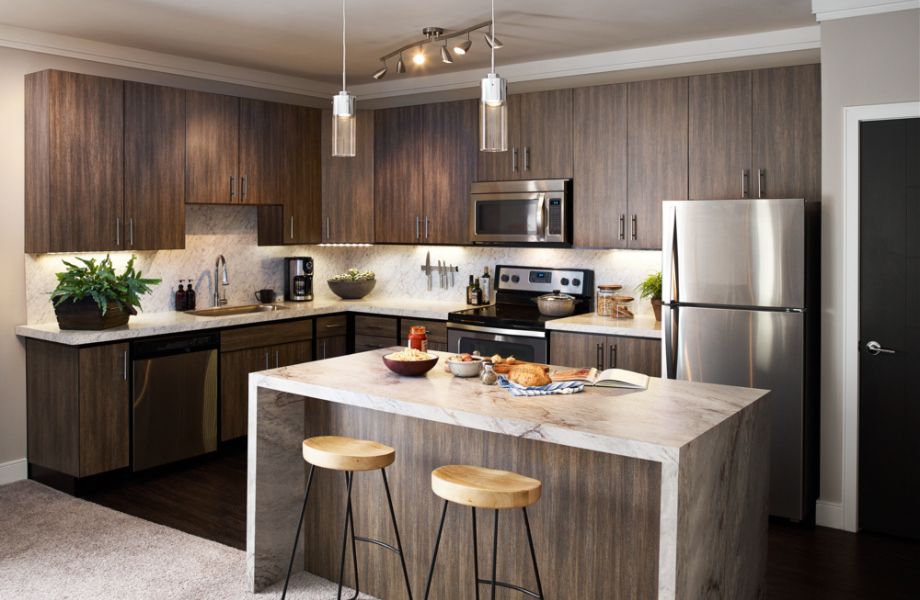 Sea Pearl kitchen island and Walnut Fiberwood kitchen cabinets